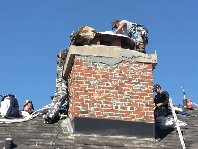 Euclid Chimney Sweep installing a custom chimney crown in Euclid, OH