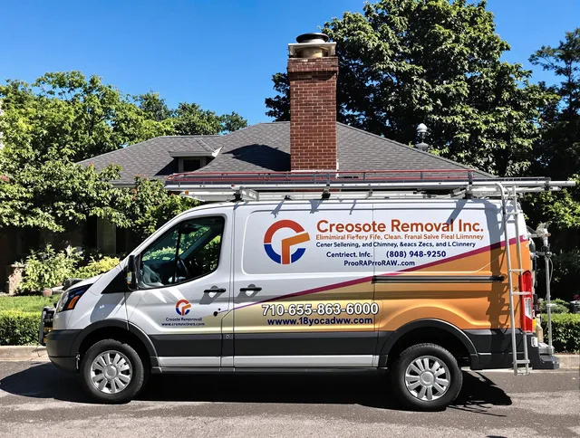 Euclid Chimney Sweep technician removing creosote safely in Euclid, OH