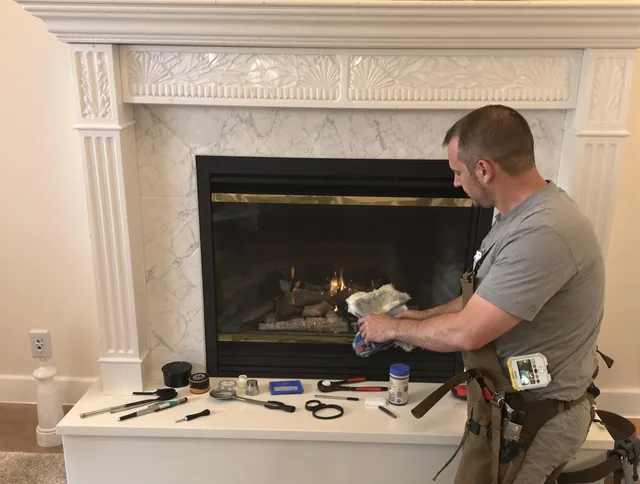 Euclid Chimney Sweep performing fireplace maintenance in Euclid, OH