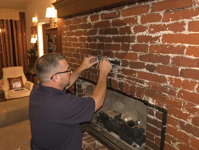 Euclid Chimney Sweep expert fixing a fireplace in Euclid, OH